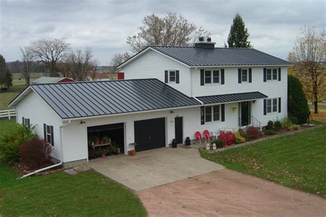 charcoal grey metal roof white brick house|grey metal roof colors.